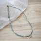 blue beaded necklace with evil eye charm